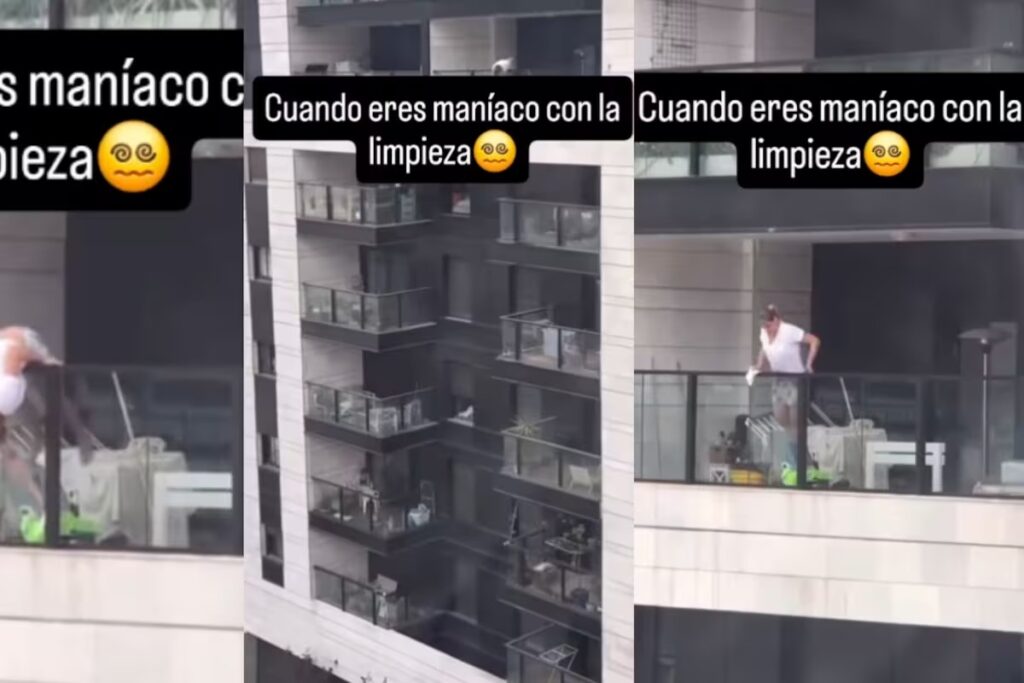 Mujer arriesga su vida para limpiar un barandal de vidrio desde las alturas