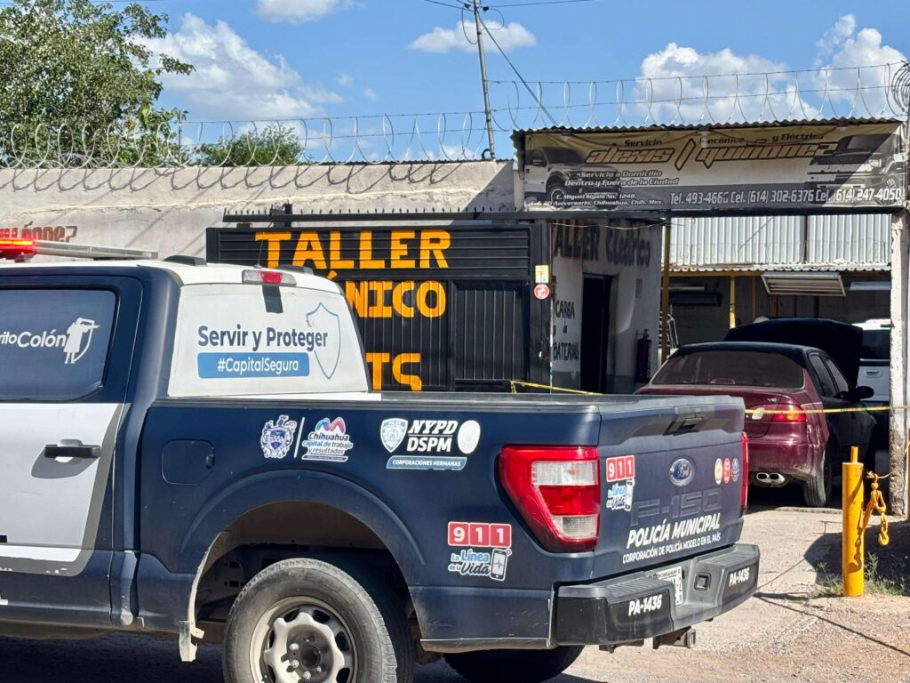 Muere prensado por vehículo en taller mecánico
